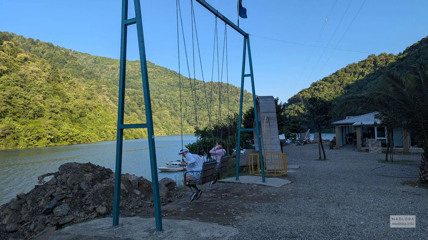 Площадка с качелями около водопада Kibura в Аджарии