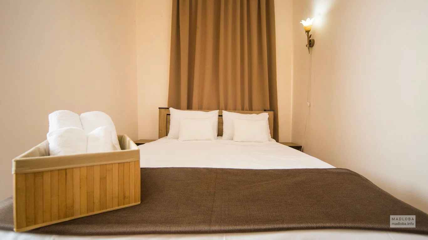Кровать в Бутик-Отель Log Inn