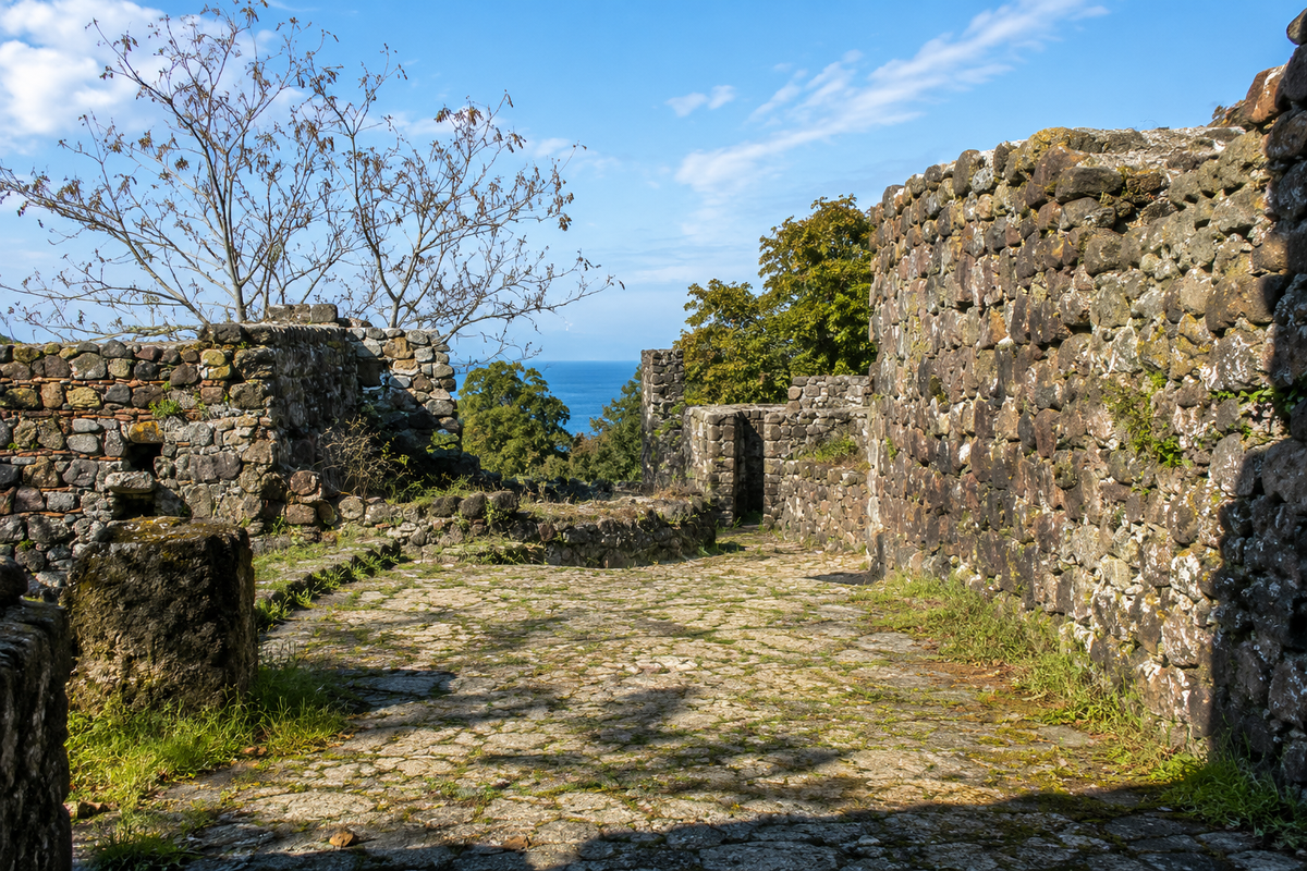 Tamar's Fortress in Adjara, Georgia, medieval stone fortress ruins, uneven ancient stone floor, low defensive walls