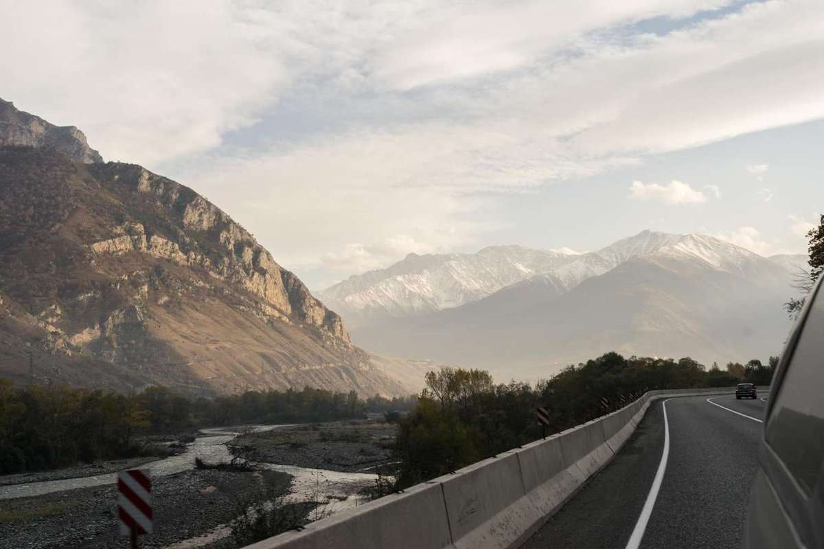 view from the car window of a mountain valley and a river