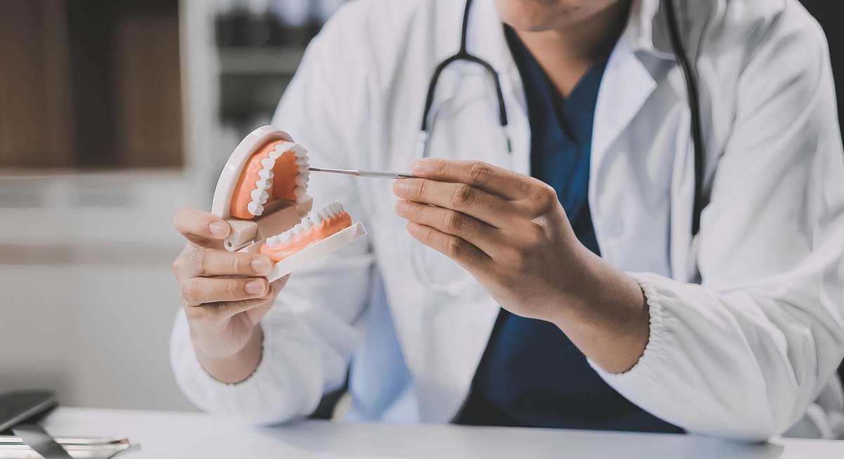 A doctor with dentures
