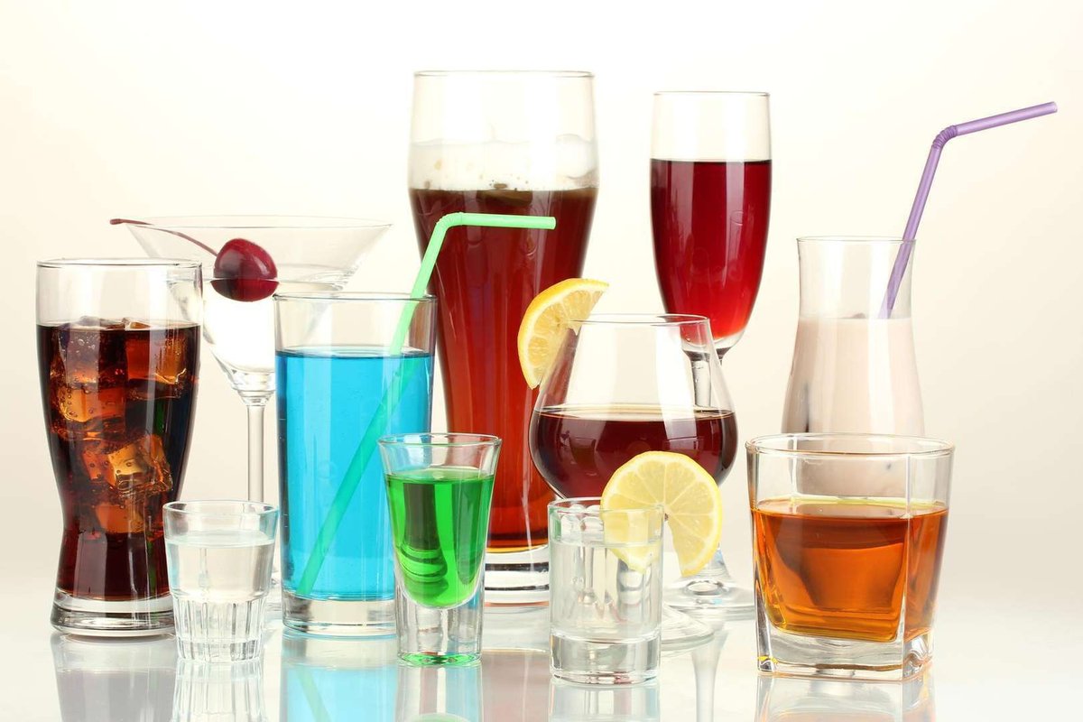 A variety of alcoholic drinks isolated on a white background