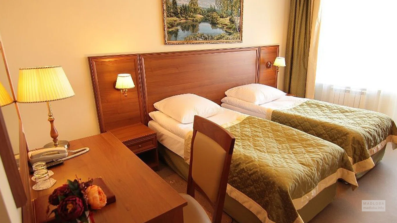 Кровать в номере гостиницы Amadeus