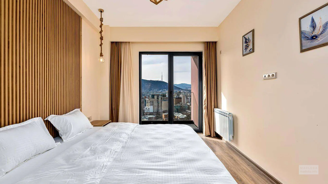 Спальня в апартаментах в BLOX Avlabari в Тбилиси