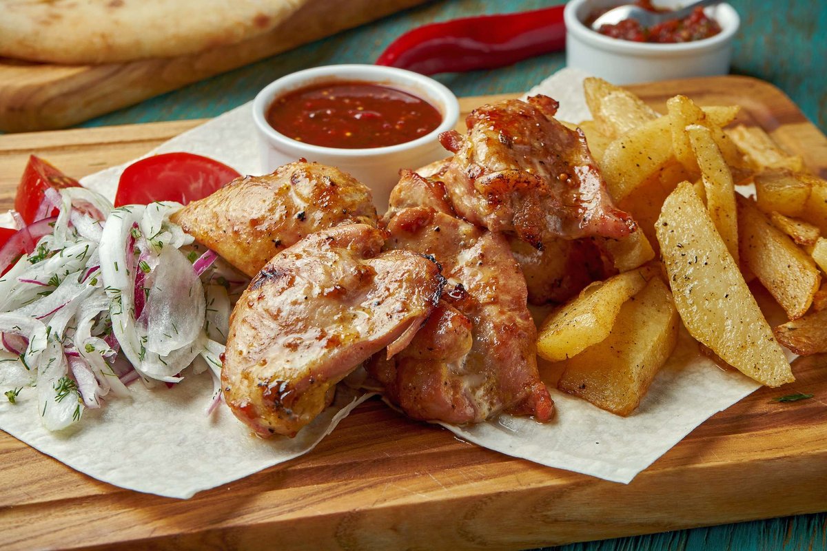 Chicken shashlik with potatoes and onions