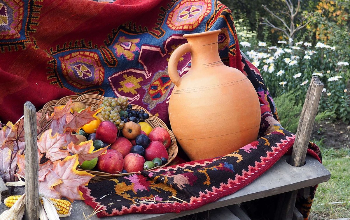 Clay jug fruits vegetables