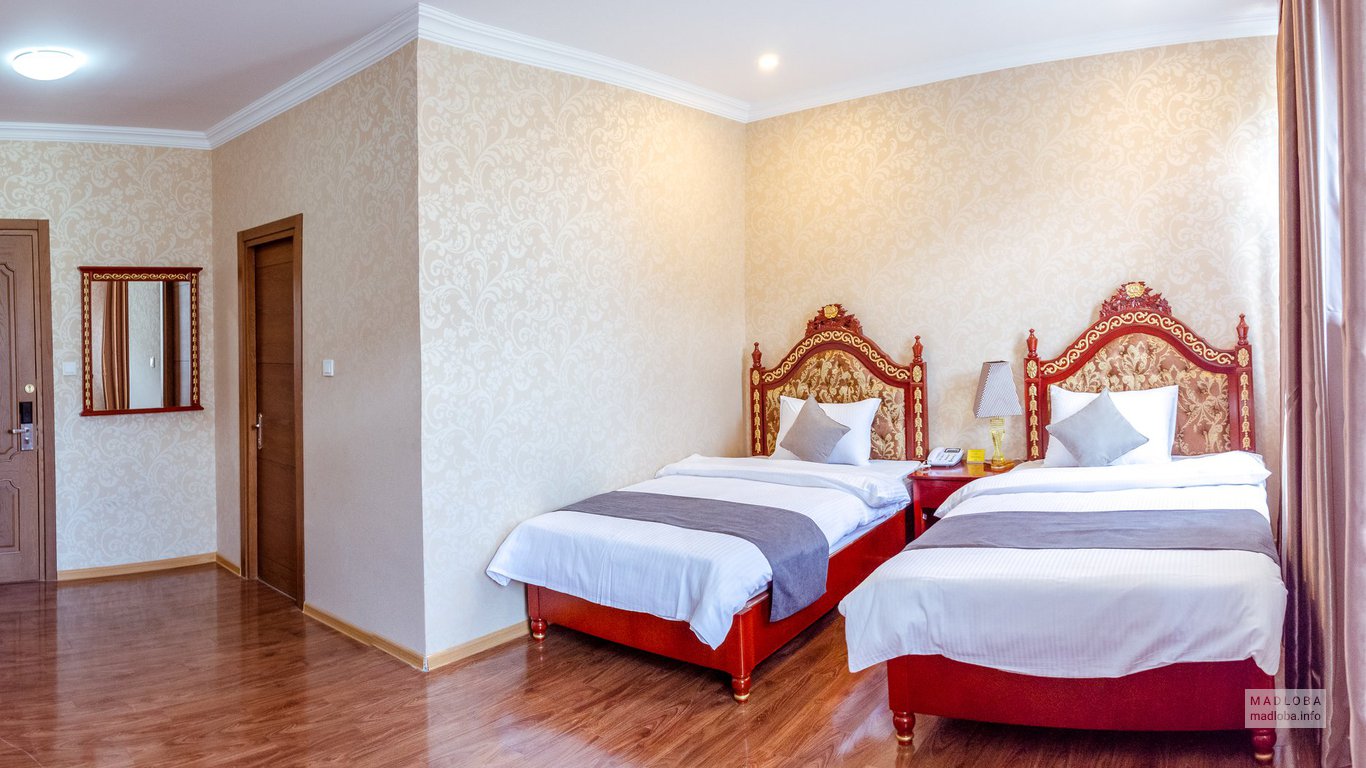 Кровати в номере в общежития Хуалинг