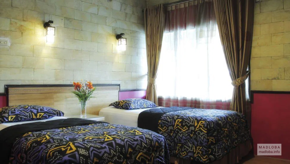 Bedroom in the Duta Hotel room