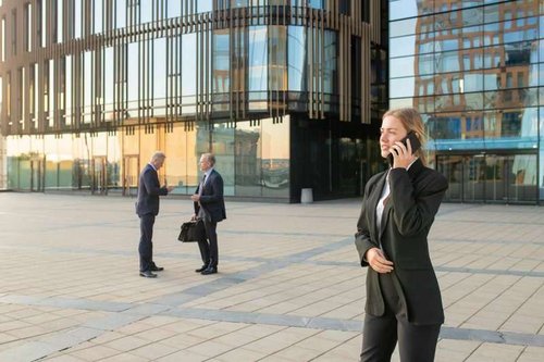 Two men and a woman near a business center