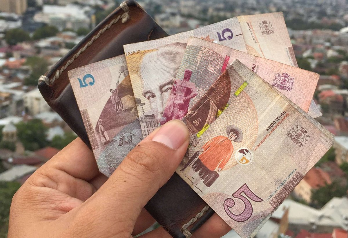 Georgian lari in hand