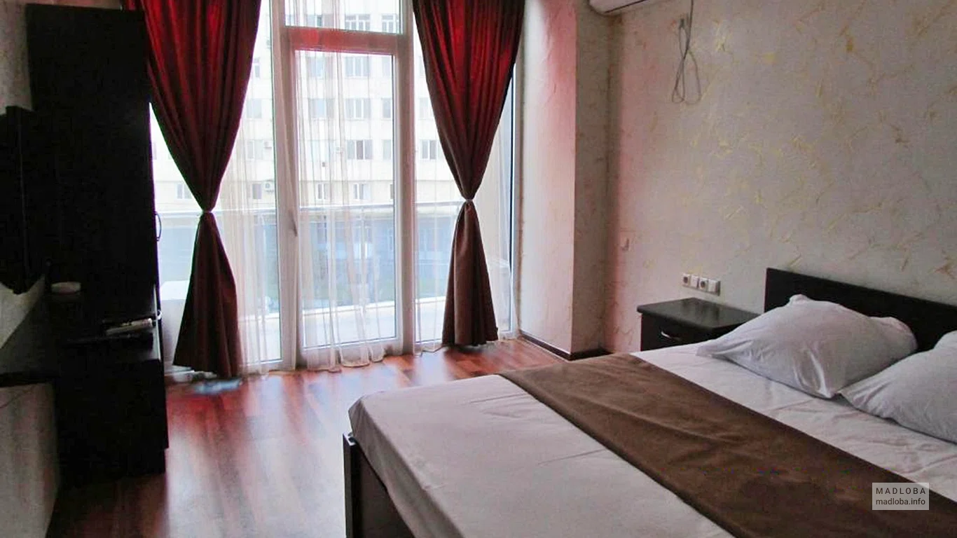 Спальня в номере отеля "Grand Palace Hotel"