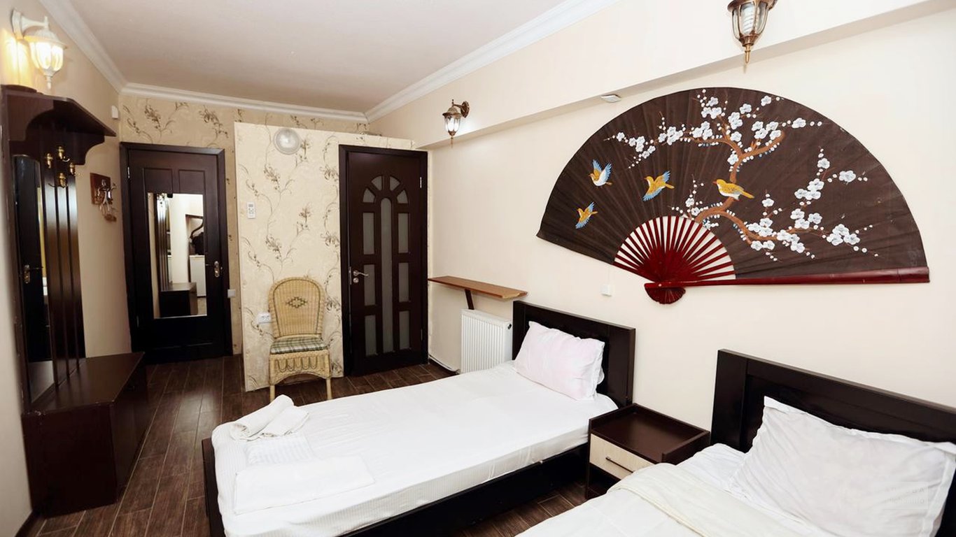Спальня в номере в отеле Исака