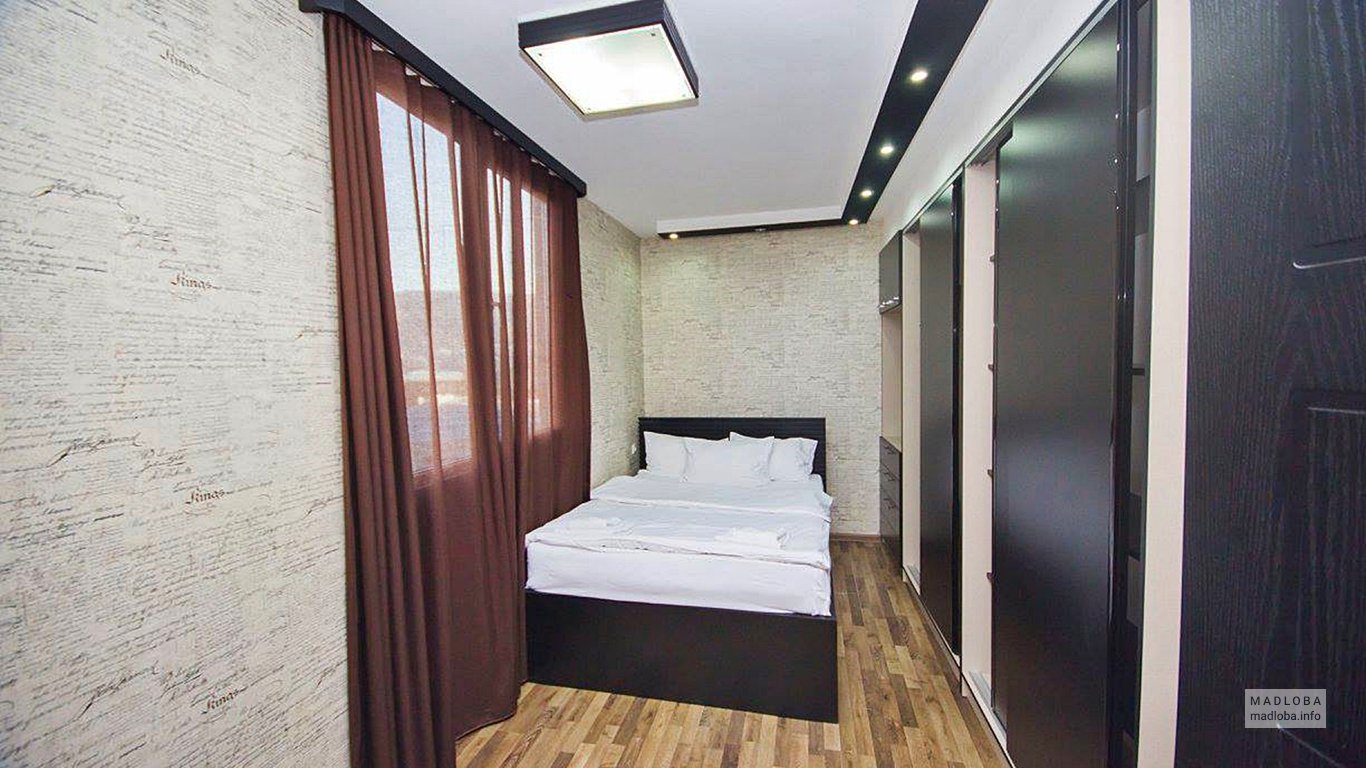 Кровать в номере отеля Orion Econom