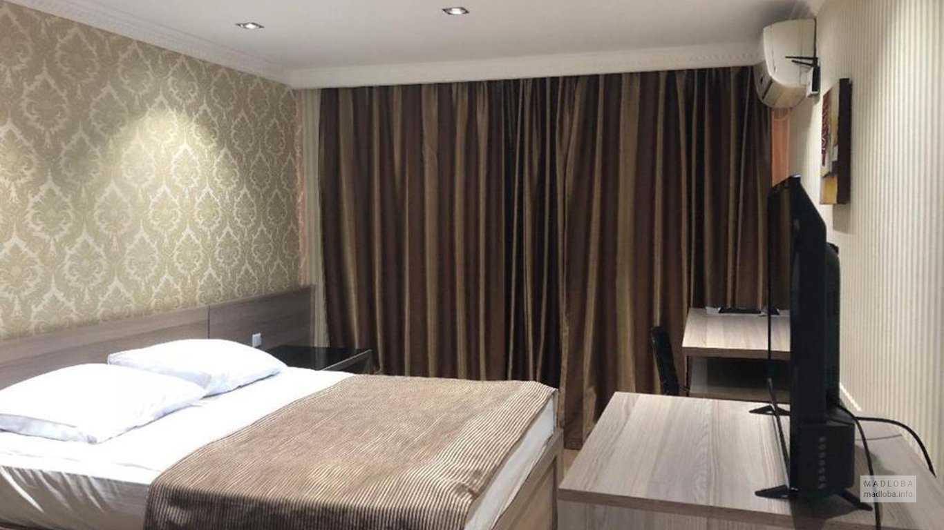 Кровать в номере Hotel Penthouse