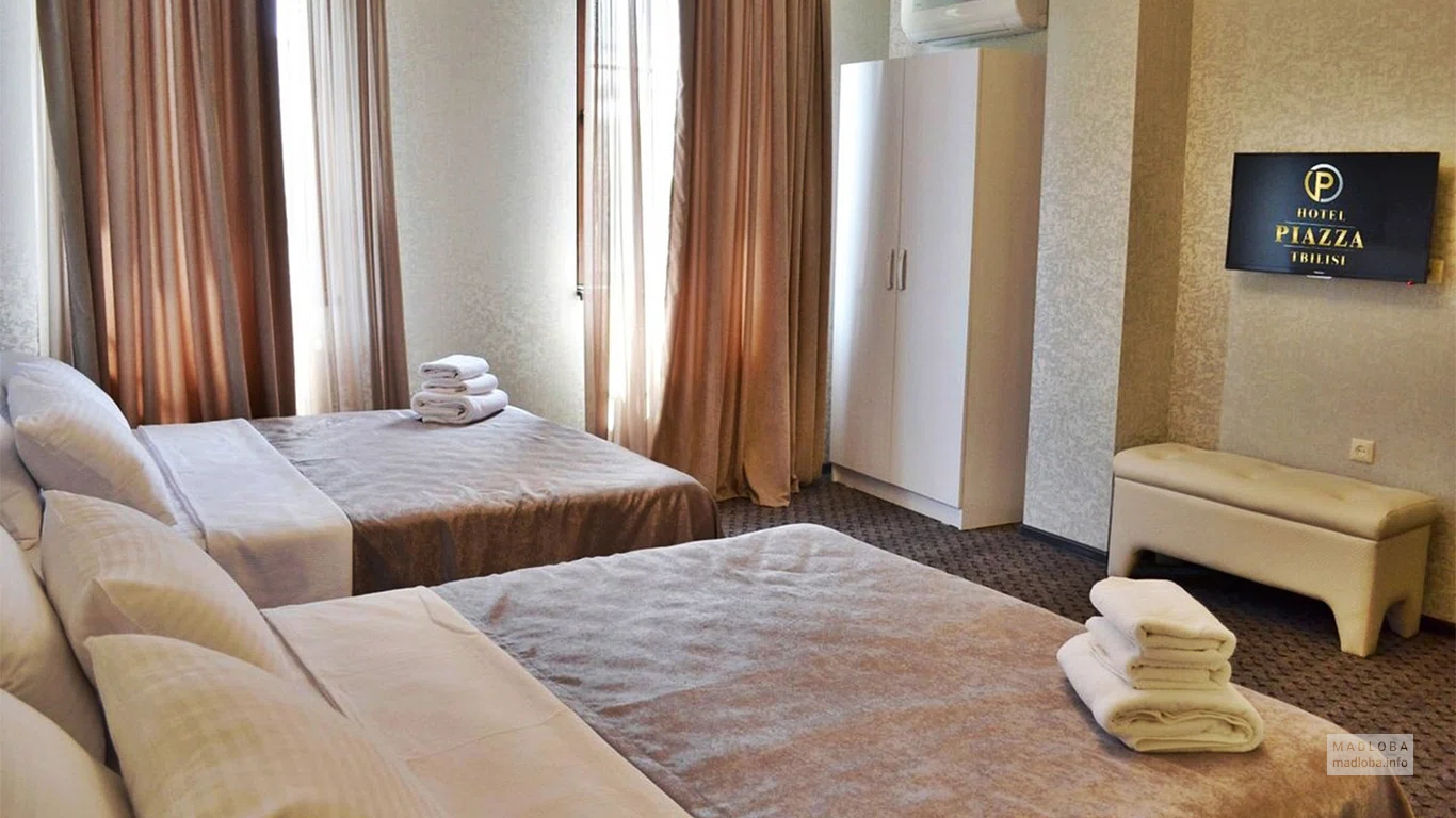 Спальня в номере отеля Пьяцца