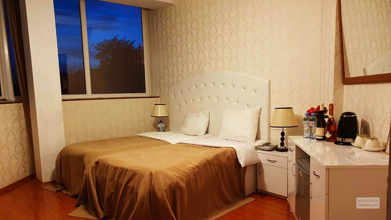 Кровать в отеле Tamosi Palace