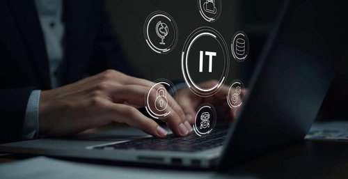Hands typing on a laptop with floating IT, security, and data icons overlaid — illustrating paid IT schools and bootcamps for adults in Georgia.