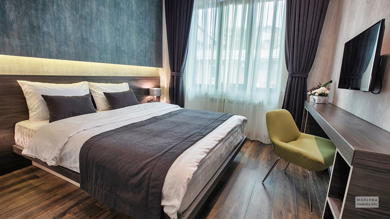 Кровать в номере отеля Дворец Копе