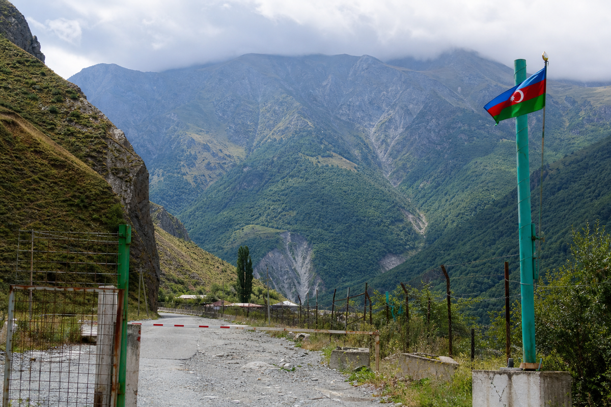 Border crossing between Azerbaijan and Georgia, highlighting uncertainty around overland travel and border restrictions.