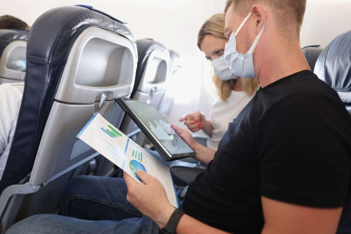 a young couple on an airplane