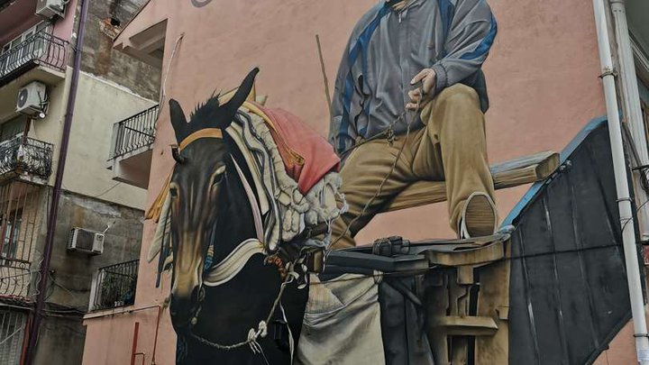NIKO Street Art: Matthias Mross - Man With The Mule Mural