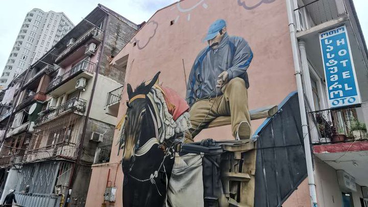 NIKO Street Art: Matthias Mross - Man With The Mule Mural