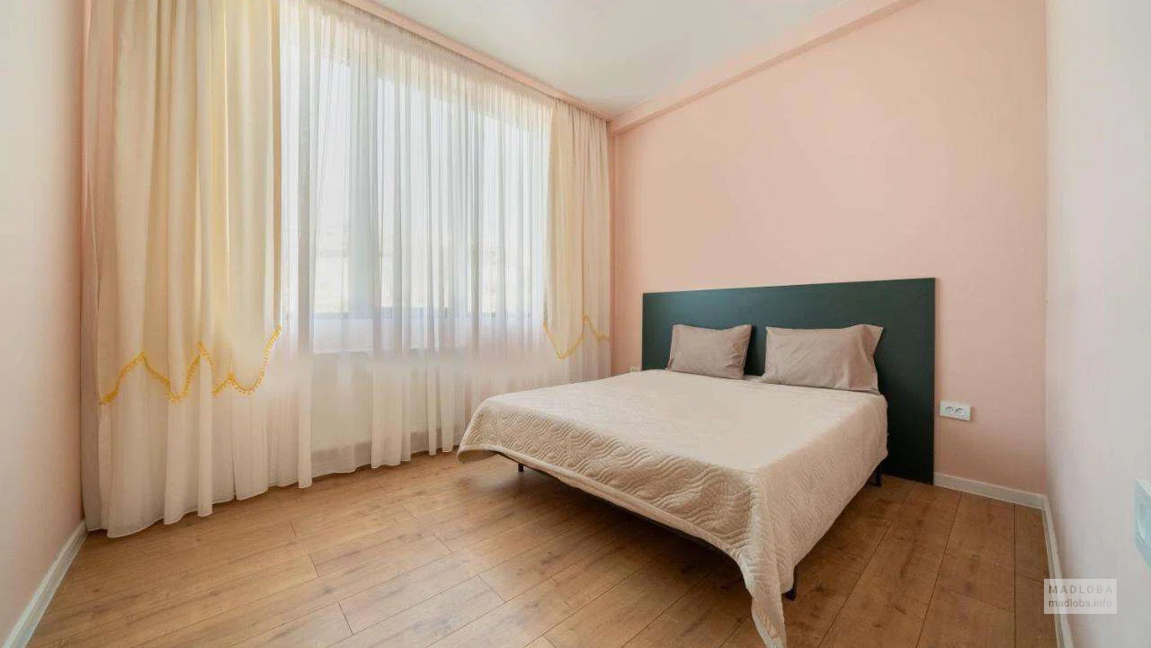 двуспальная кровать в Niabi Loft Apartments