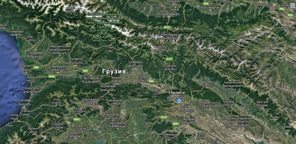 A satellite map showing Tbilisi, Kutaisi, Batumi, and other Georgian cities connected by highways, with the Black Sea coast to the west and Caucasus peaks to the north.