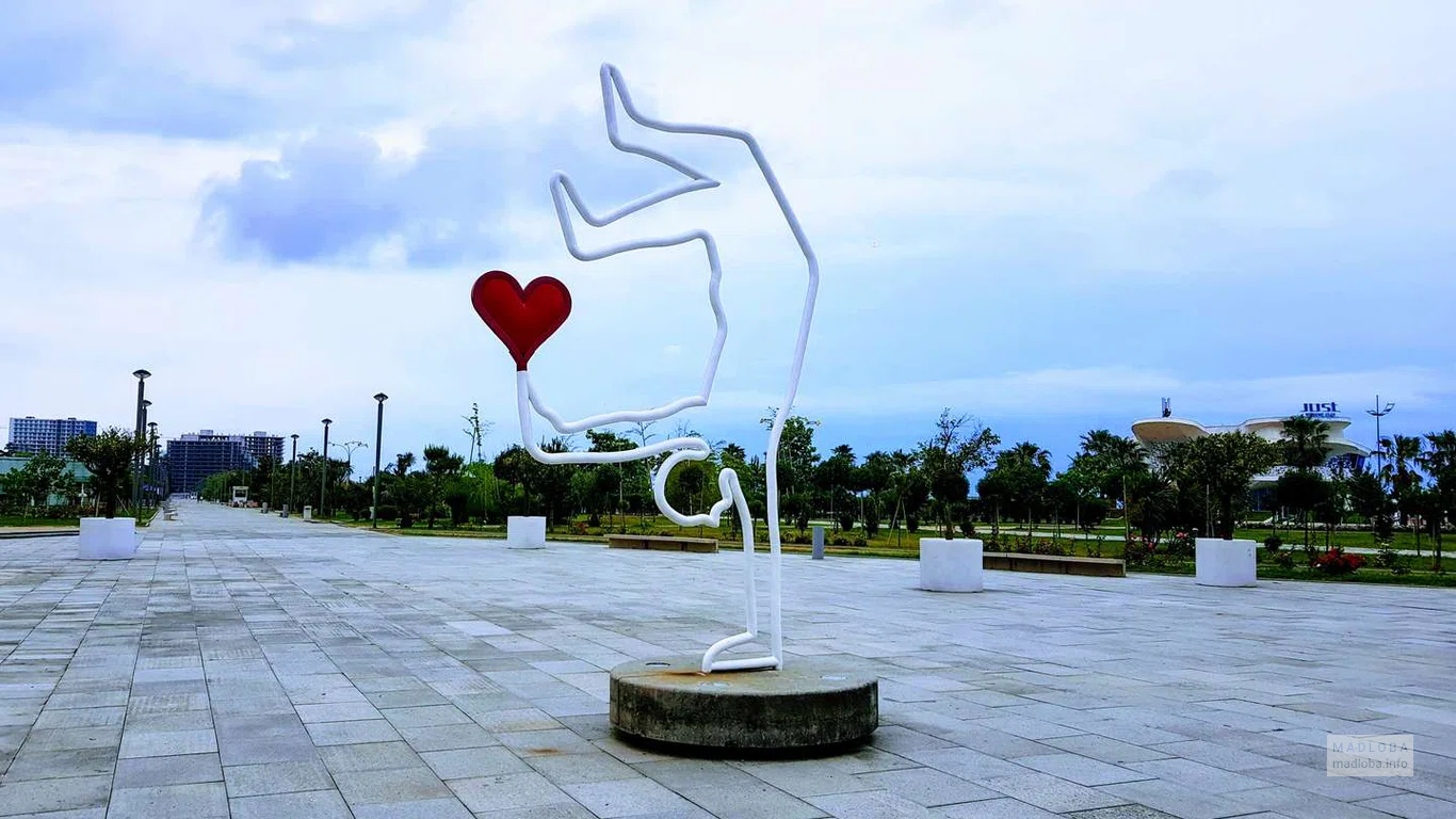 Sculpture "A man stands on one hand and holds a heart in the other"