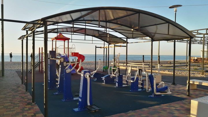 Sports ground, exercise equipment and football field on the beach