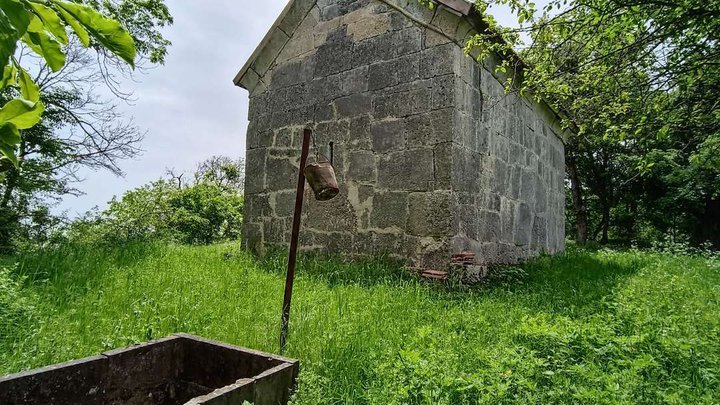 Trinity Church of Chkhikvta with a megalithic fence