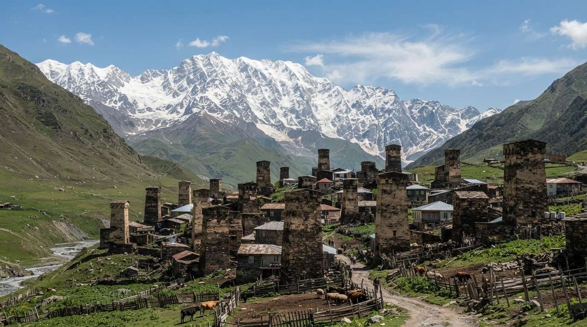 The iconic stone towers of Ushguli rise beneath the snow-covered peaks of the Greater Caucasus. This UNESCO World Heritage village preserves one of Georgia's most remarkable collections of medieval defensive architecture.