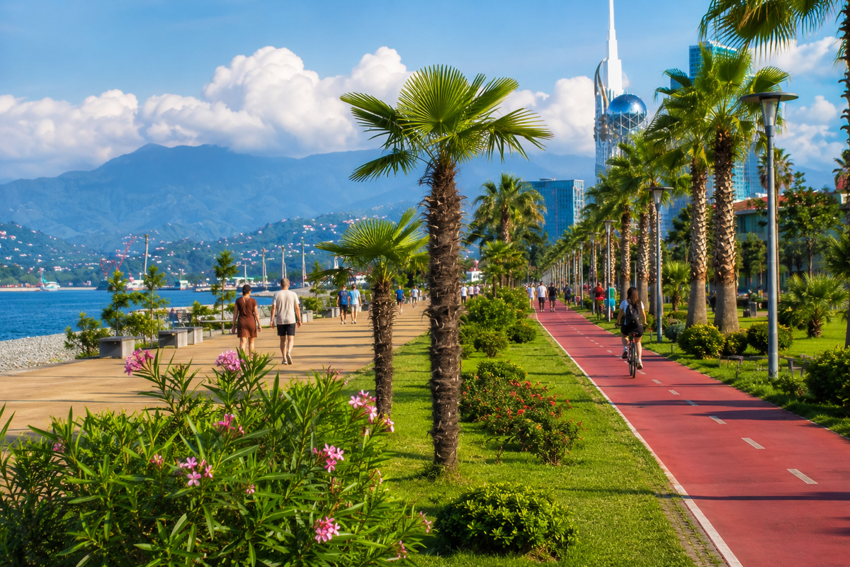 A sunny Batumi promenade with palms, sea views, bike paths and greenery, showing how the city’s parks help make seaside walks comfortable and scenic.