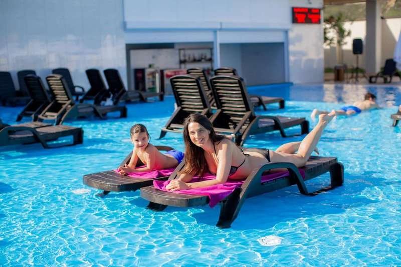 a-woman-with-her-son-is-lying-on-a-rod-by-th.max-800x600