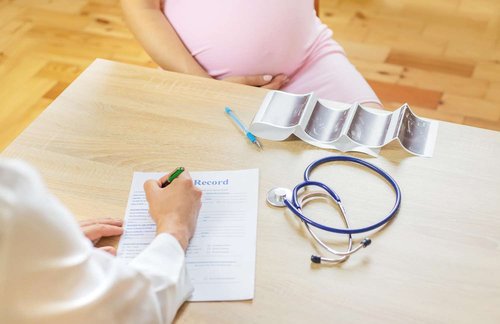 a pregnant girl at a doctor's appointment
