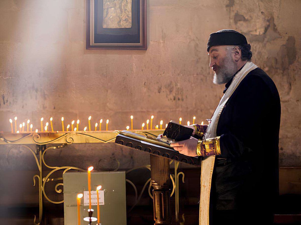 a priest reads a prayer in a church