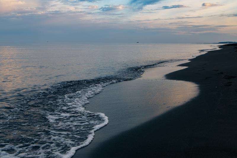 Black sand and black sea of ​​Ureki