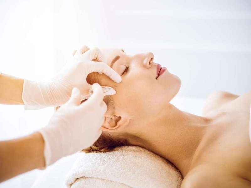 a girl during an injection cosmetology session