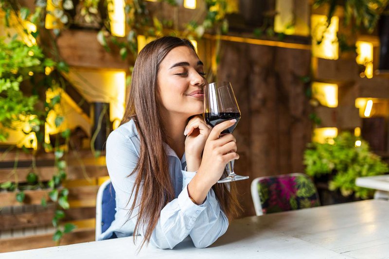 A girl enjoys Georgian wine