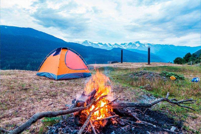 A campfire and a tent in the mountains of Georgia