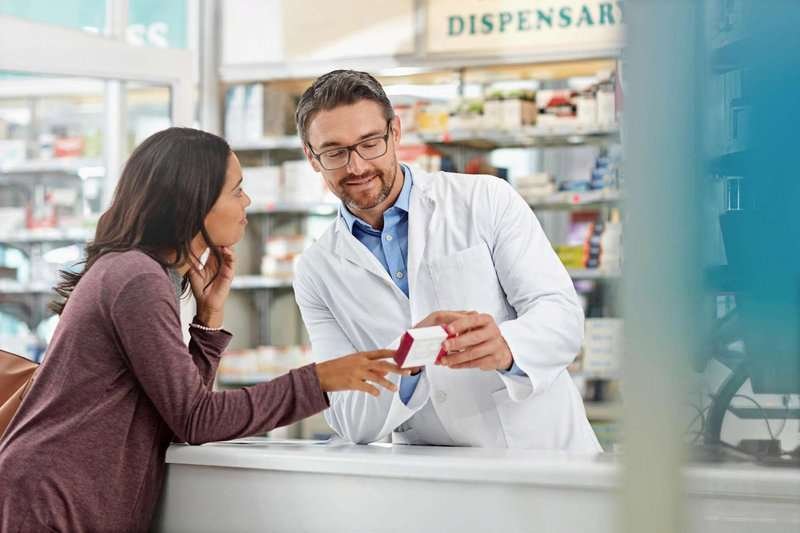 a male pharmacist recommends medicine