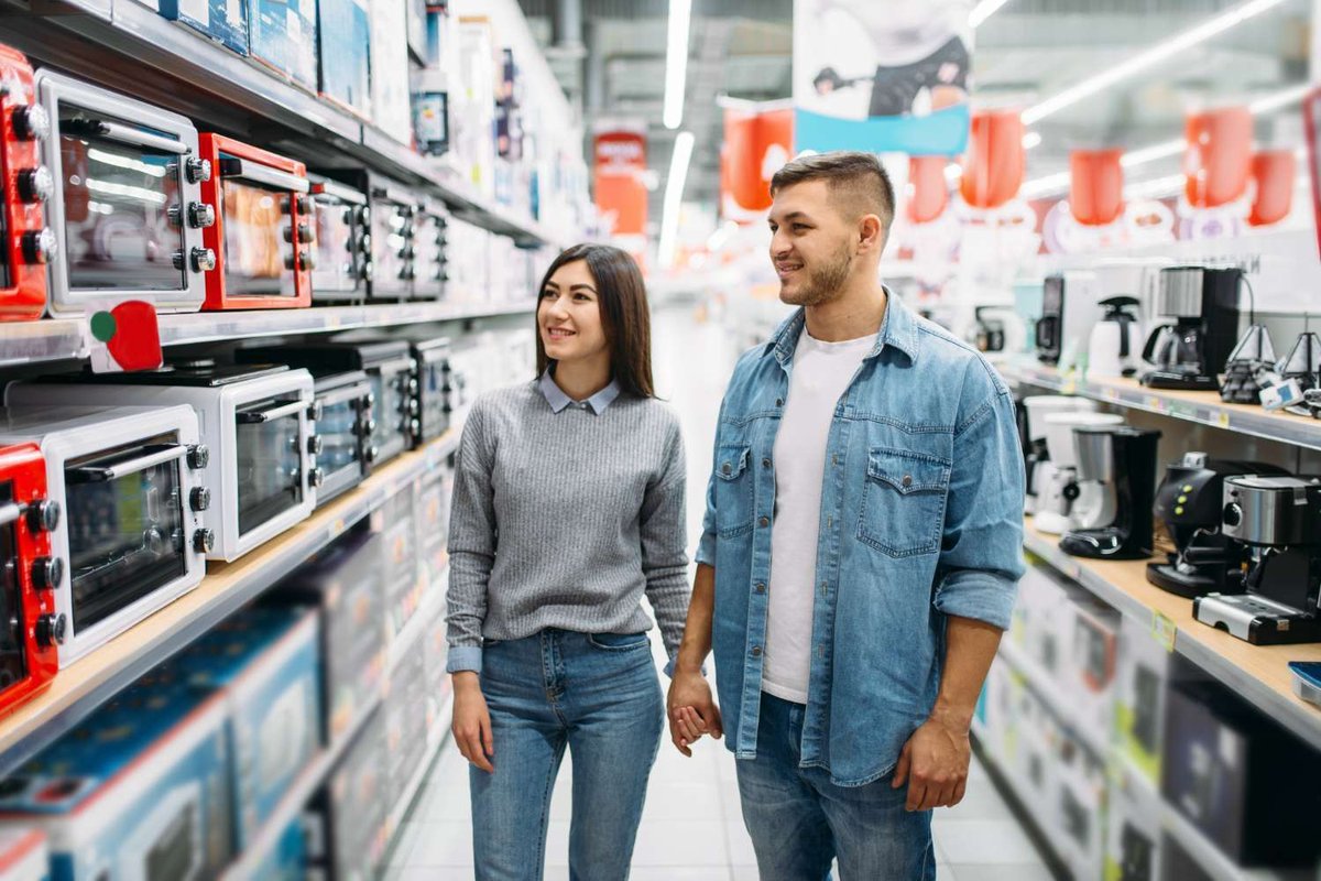 couple in an electronics store