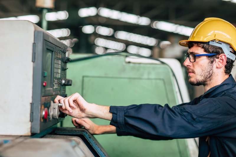 A male engineer in a helmet