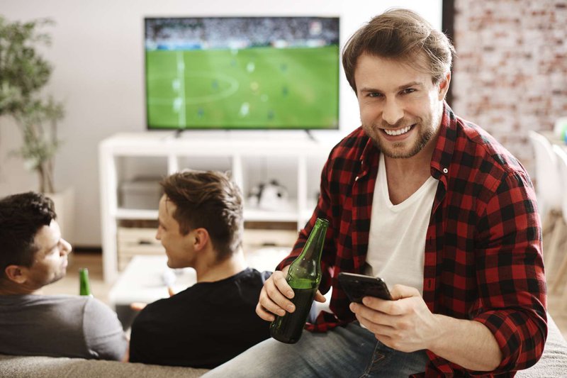 football-fans-with-mobile-phone-and-beer.jpg