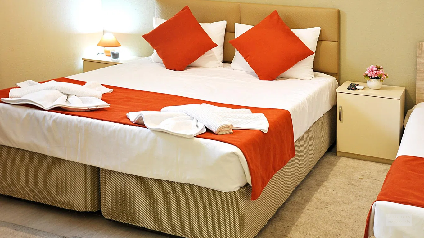 Кровать в номере гостиницы Безымянная