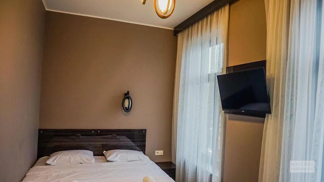 Спальня в номере отеля Посейдон