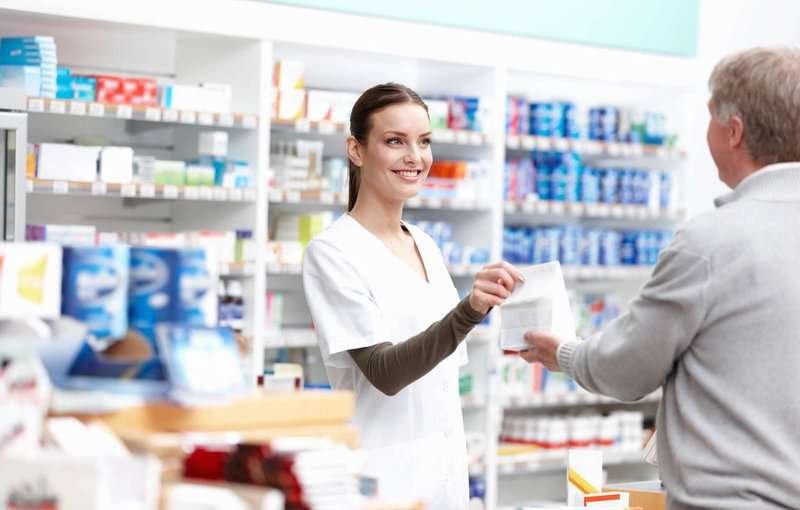 a pharmacist sells medications