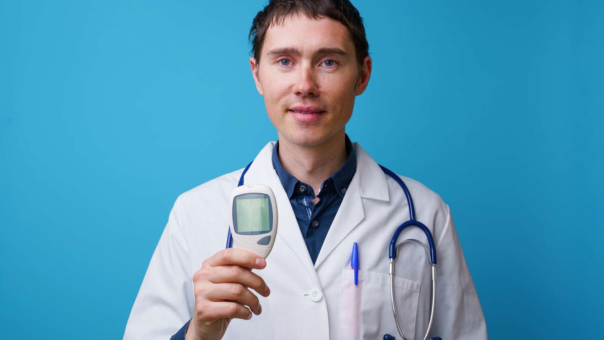 portrait-doctor-with-stethoscope-blood-glucose-meterin-his-hand