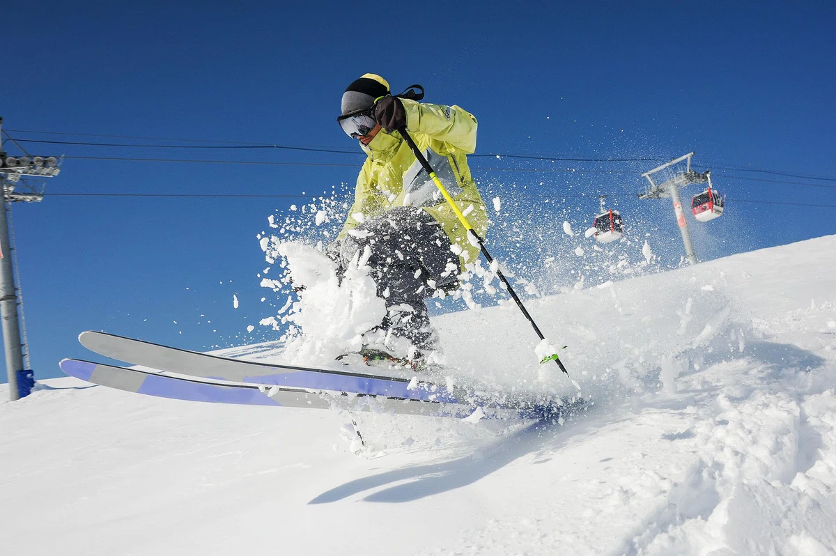 professional-skier-yellow-sportswear-riding-down-slope-georgia-gudauri.jpg