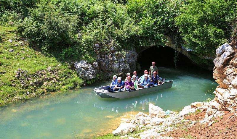 People in a boat at Prometheus's cave